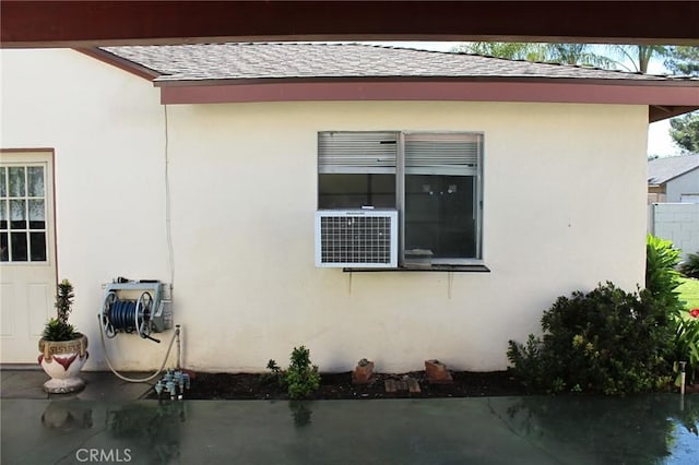 836 N 10th Ave, Upland, CA 91786 - view of side of property with a shingled roof, stucco siding, and cooling unit