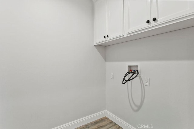 5612 Sprague Ave, Cypress, CA 90630 - laundry room with cabinet space, wood finished floors, and washer hookup