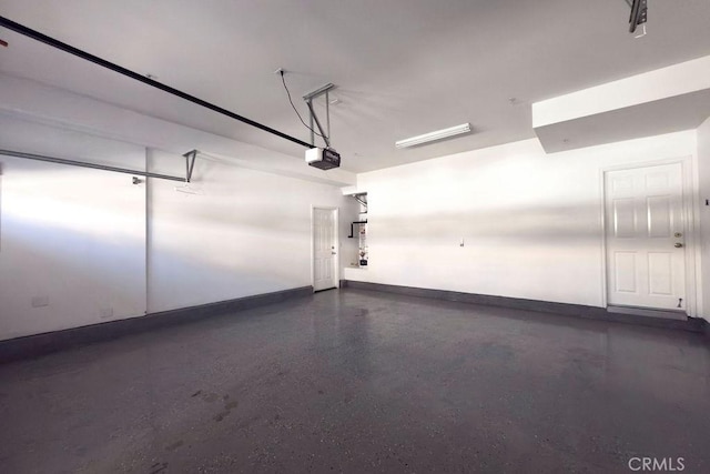 5612 Sprague Ave, Cypress, CA 90630 - garage with a garage door opener and baseboards