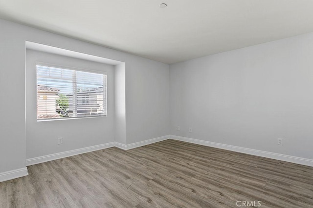 5612 Sprague Ave, Cypress, CA 90630 - empty room with wood finished floors and baseboards