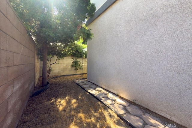 5612 Sprague Ave, Cypress, CA 90630 - view of side of home with a fenced backyard and stucco siding
