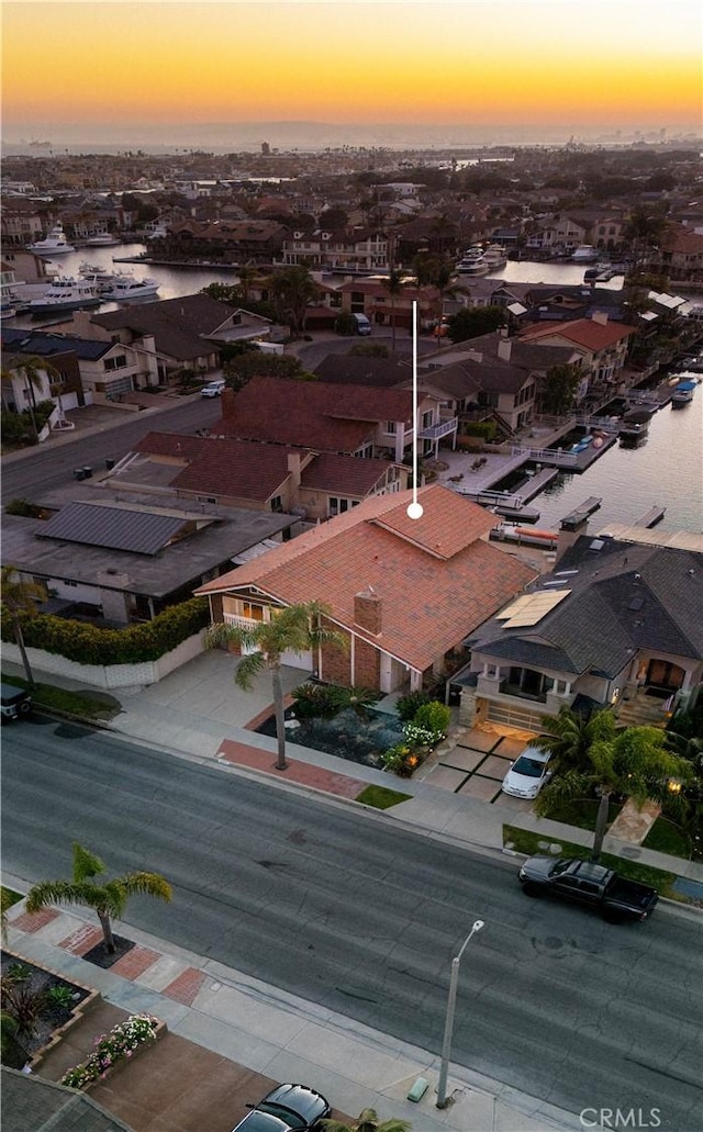 3871 Mistral Dr, Huntington Beach, CA 92649 - aerial view at dusk of a residential view and a water view