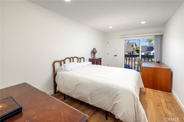 3871 Mistral Dr, Huntington Beach, CA 92649 - bedroom with access to exterior, wood finished floors, and recessed lighting