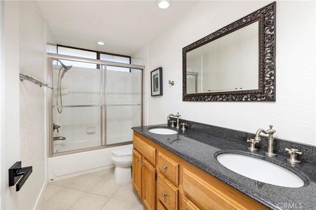 3871 Mistral Dr, Huntington Beach, CA 92649 - full bathroom with double vanity, bath / shower combo with glass door, tile patterned floors, and recessed lighting