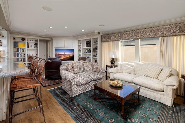 3871 Mistral Dr, Huntington Beach, CA 92649 - living area with wood finished floors, ornamental molding, built in shelves, and recessed lighting