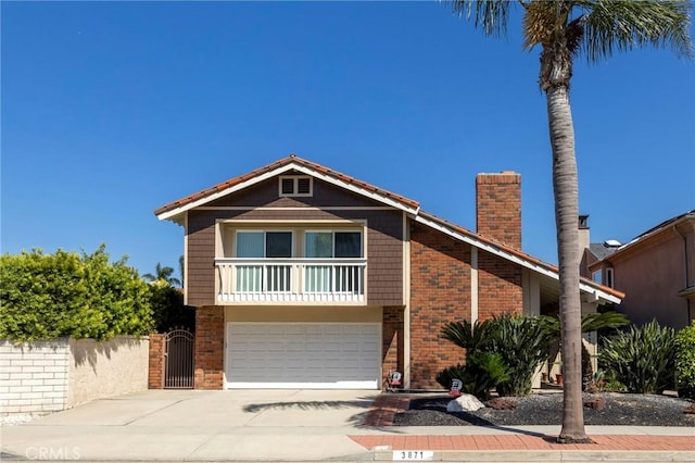 3871 Mistral Dr, Huntington Beach, CA 92649 - view of front of home featuring brick siding, concrete driveway, a chimney, and a garage