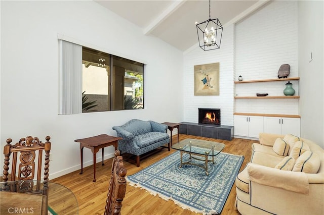 3871 Mistral Dr, Huntington Beach, CA 92649 - living area featuring a tile fireplace, a chandelier, and light wood finished floors