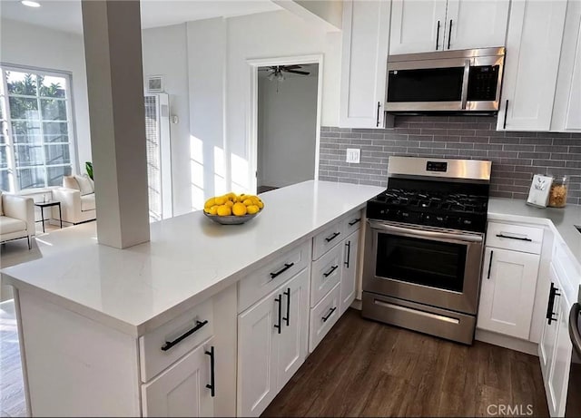 10802 Palma Vista Ave, Garden Grove, CA 92840 - kitchen with stainless steel appliances, a peninsula, tasteful backsplash, dark wood finished floors, and recessed lighting