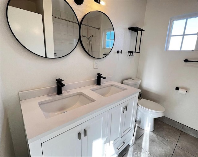 10802 Palma Vista Ave, Garden Grove, CA 92840 - bathroom featuring double vanity, tile patterned floors, and a shower
