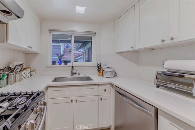 2201 Dublin Ln Unit 3, Diamond Bar, CA 91765 - kitchen featuring appliances with stainless steel finishes, exhaust hood, and white cabinetry