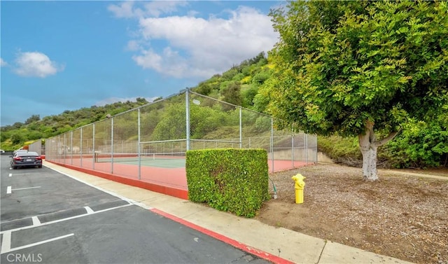 2201 Dublin Ln Unit 3, Diamond Bar, CA 91765 - surrounding community featuring a tennis court and uncovered parking