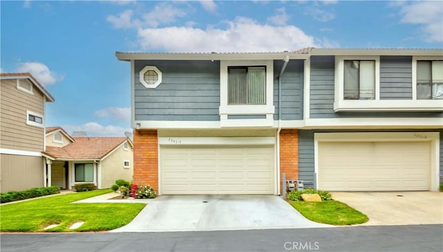 2201 Dublin Ln Unit 3, Diamond Bar, CA 91765 - view of front facade with an attached garage, brick siding, and driveway