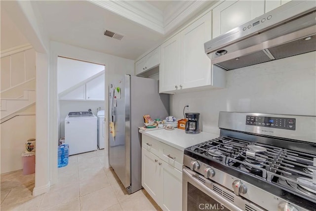 2201 Dublin Ln Unit 3, Diamond Bar, CA 91765 - kitchen with appliances with stainless steel finishes, under cabinet range hood, white cabinetry, separate washer and dryer, and light countertops