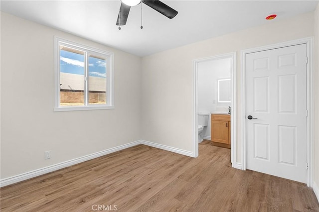530 E 3rd St, Rialto, CA 92376 - unfurnished bedroom with light wood finished floors and ensuite bathroom