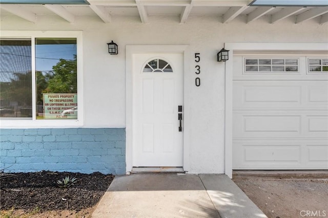 530 E 3rd St, Rialto, CA 92376 - doorway to property featuring stucco siding