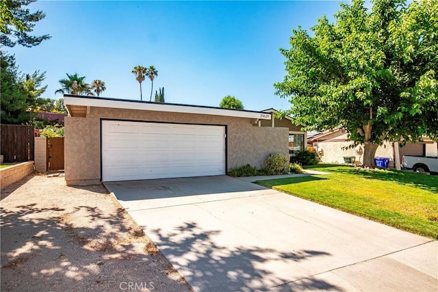 29639 Delphinium Ave, Canyon Country, CA 91387 - view of front facade with stucco siding, driveway, and a garage