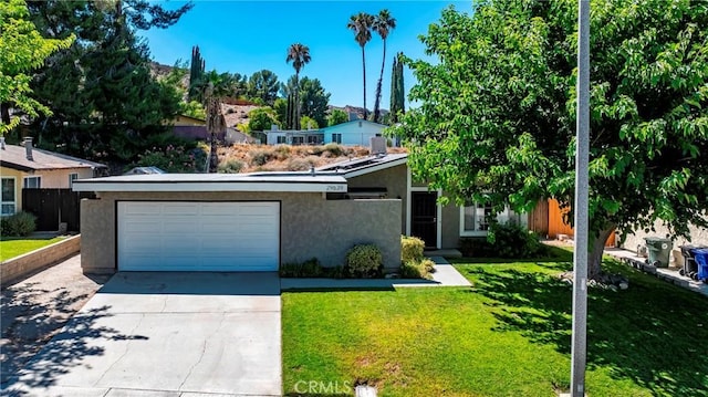 29639 Delphinium Ave, Canyon Country, CA 91387 - view of front of house with driveway, stucco siding, a front lawn, and a garage