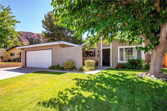 29639 Delphinium Ave, Canyon Country, CA 91387 - view of front of home featuring stucco siding, concrete driveway, an attached garage, and a mountain view