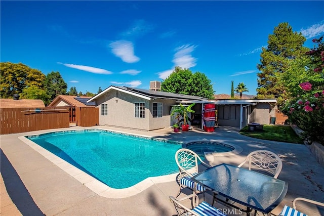 29639 Delphinium Ave, Canyon Country, CA 91387 - view of swimming pool featuring a patio area, a fenced backyard, a pool with connected hot tub, and outdoor dining area
