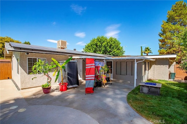 29639 Delphinium Ave, Canyon Country, CA 91387 - view of front of house featuring solar panels, stucco siding, and a patio