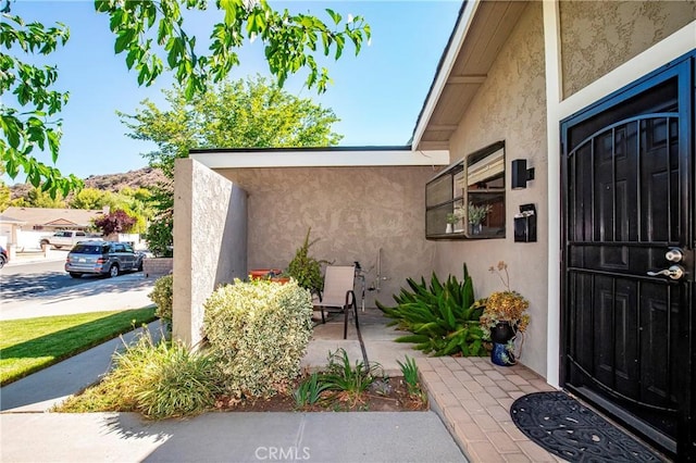 29639 Delphinium Ave, Canyon Country, CA 91387 - doorway to property with stucco siding