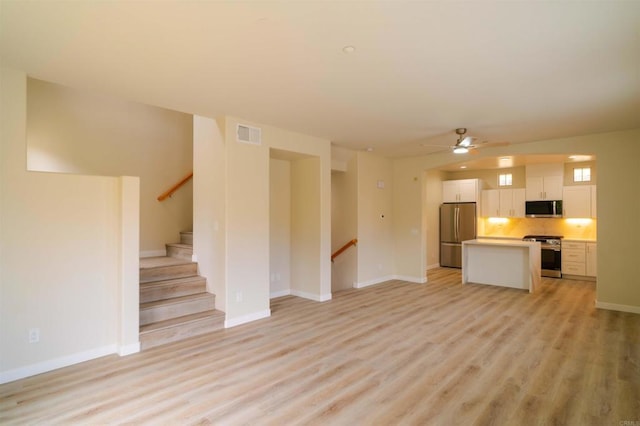 1295 Haglar Unit 1, Chula Vista, CA 91913 - unfurnished living room with light wood finished floors and ceiling fan