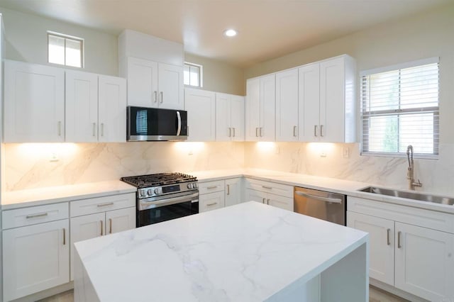 1295 Haglar Unit 1, Chula Vista, CA 91913 - kitchen featuring stainless steel appliances, a kitchen island, plenty of natural light, and recessed lighting
