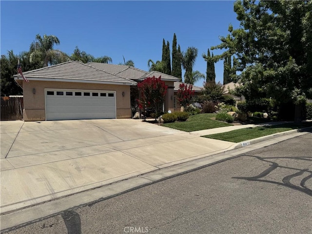 844 Park Place Dr, Exeter, CA 93221 - single story home featuring a garage, a tiled roof, stucco siding, and driveway