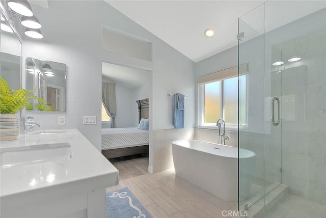 16549 Celadon Ct, Chino Hills, CA 91709 - ensuite bathroom with tile walls, plenty of natural light, a freestanding tub, a shower stall, and lofted ceiling