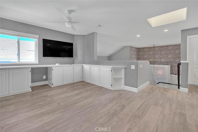 16549 Celadon Ct, Chino Hills, CA 91709 - unfurnished living room with light wood-type flooring, a skylight, a ceiling fan, wallpapered walls, and recessed lighting