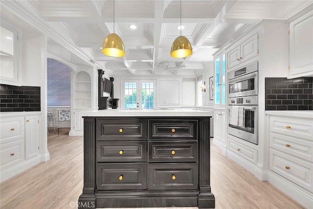 16549 Celadon Ct, Chino Hills, CA 91709 - kitchen featuring white cabinets, double oven, light wood finished floors, backsplash, and beam ceiling