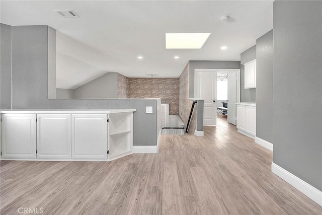 16549 Celadon Ct, Chino Hills, CA 91709 - additional living space featuring a skylight, light wood-style flooring, and lofted ceiling