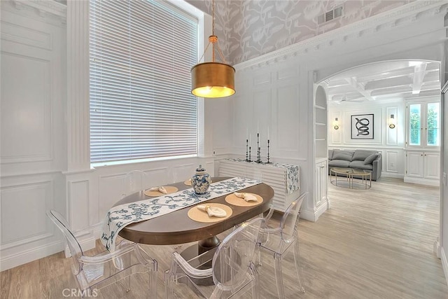 16549 Celadon Ct, Chino Hills, CA 91709 - dining room with a decorative wall, arched walkways, light wood-style floors, coffered ceiling, and wallpapered walls