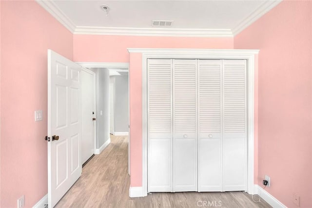 16549 Celadon Ct, Chino Hills, CA 91709 - unfurnished bedroom with ornamental molding, light wood-style flooring, and a closet
