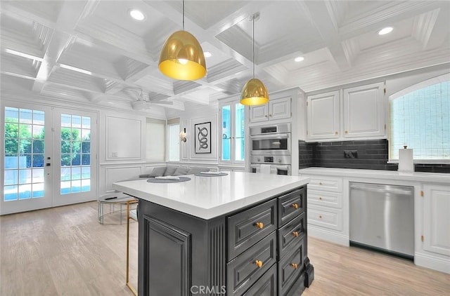 16549 Celadon Ct, Chino Hills, CA 91709 - kitchen featuring appliances with stainless steel finishes, white cabinetry, light wood-style floors, light countertops, and coffered ceiling