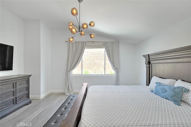 16549 Celadon Ct, Chino Hills, CA 91709 - bedroom with light wood-style flooring, a chandelier, and lofted ceiling