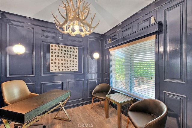 16549 Celadon Ct, Chino Hills, CA 91709 - living area with a chandelier, a decorative wall, and light wood-style flooring