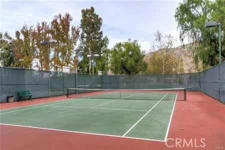 10600 Silverleaf Cir, Moreno Valley, CA 92557 - view of tennis court with community basketball court
