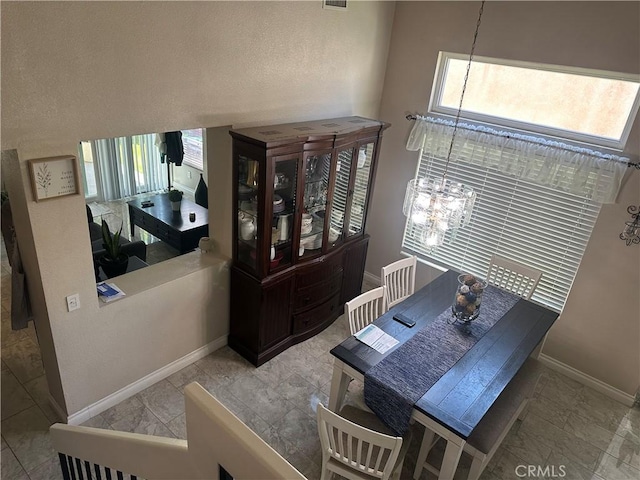 10600 Silverleaf Cir, Moreno Valley, CA 92557 - dining room featuring a chandelier and baseboards