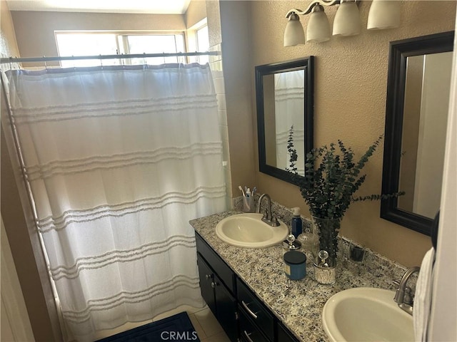 10600 Silverleaf Cir, Moreno Valley, CA 92557 - bathroom with plenty of natural light, double vanity, and a shower with shower curtain