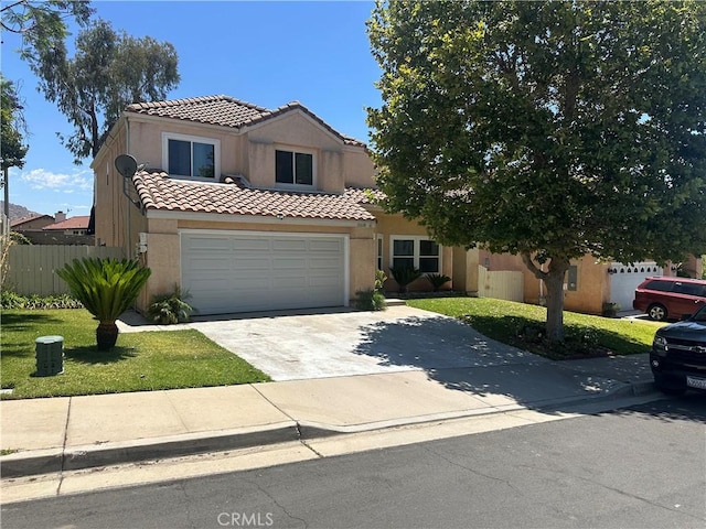 10600 Silverleaf Cir, Moreno Valley, CA 92557 - view of front facade featuring driveway, a tile roof, and stucco siding