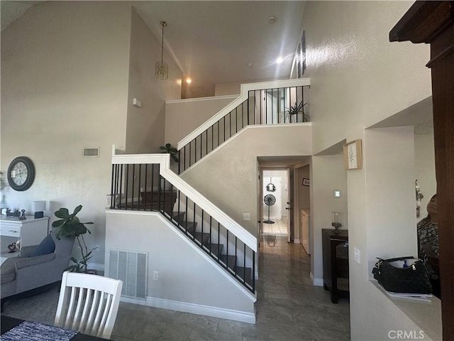 10600 Silverleaf Cir, Moreno Valley, CA 92557 - staircase with a high ceiling