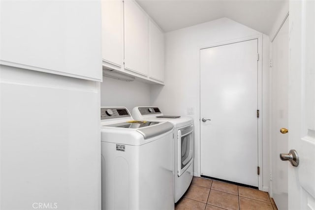 3450 Lake Park Ave, Fallbrook, CA 92028 - laundry area featuring separate washer and dryer, cabinet space, and light tile patterned flooring