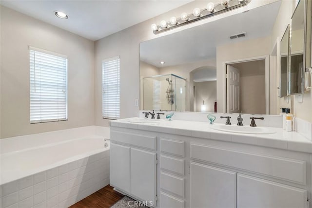 3450 Lake Park Ave, Fallbrook, CA 92028 - full bath with a shower stall, double vanity, a bath, and wood finished floors