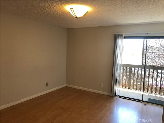1112 S Meyler St Unit 8, San Pedro, CA 90731 - unfurnished room with wood finished floors and a textured ceiling