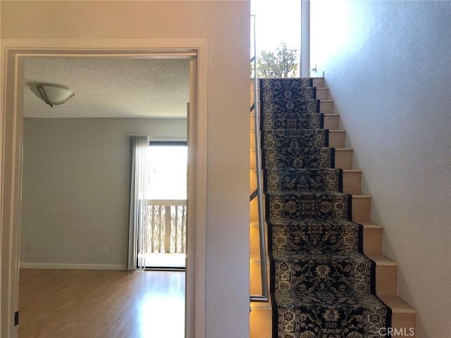 1112 S Meyler St Unit 8, San Pedro, CA 90731 - stairs featuring wood finished floors and baseboards