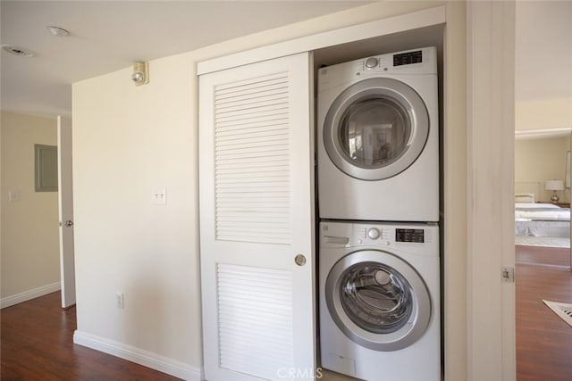 530 W Stocker St Unit 205, Glendale, CA 91202 - laundry area with stacked washer / dryer, dark wood-style flooring, and electric panel