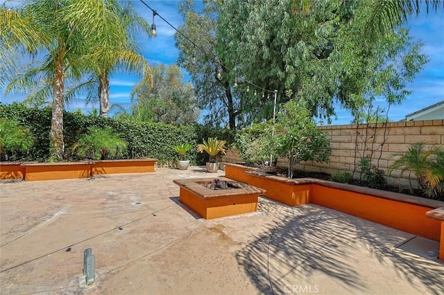 23609 Wilmington Ct, Valencia, CA 91354 - view of patio featuring an outdoor fire pit
