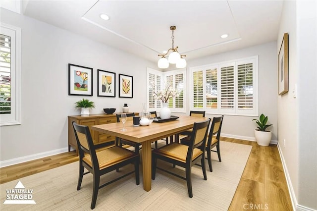 23609 Wilmington Ct, Valencia, CA 91354 - dining room featuring plenty of natural light, light wood-style flooring, recessed lighting, and a tray ceiling