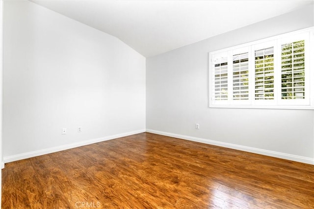 23609 Wilmington Ct, Valencia, CA 91354 - spare room featuring lofted ceiling, wood finished floors, and healthy amount of natural light